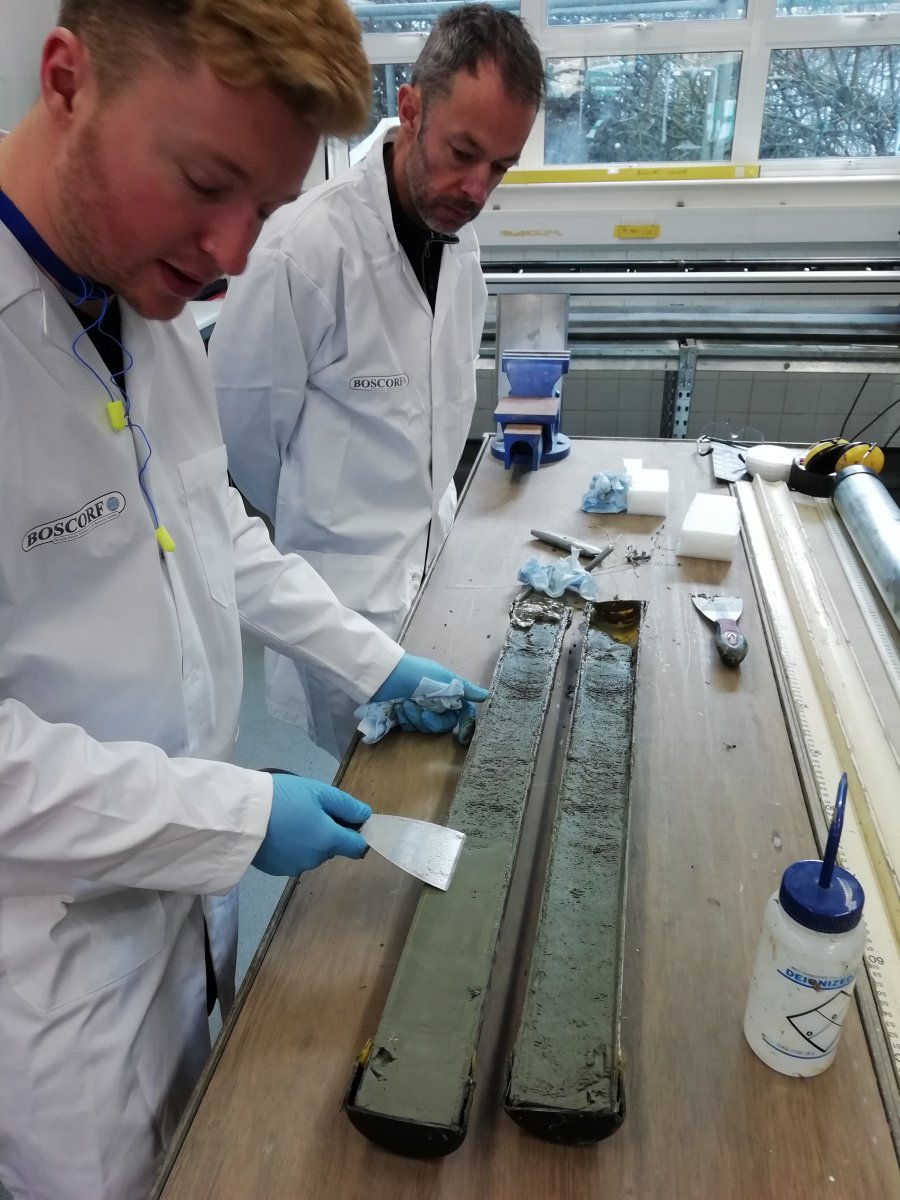 Image 3: Tom Bradwell (University of Stirling) and Mike Edwards (BOSCORF) assessing the condition of a recently split sediment core in the BOSCORF Laboratory (image courtesy of Allan Audsley)