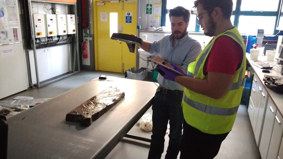 Rodrigo Pacheco-Ruiz and Felix Pedrotti laser scanning in BOSCORF one of the recovered timbers from the 400BC Ancient Greek wreck